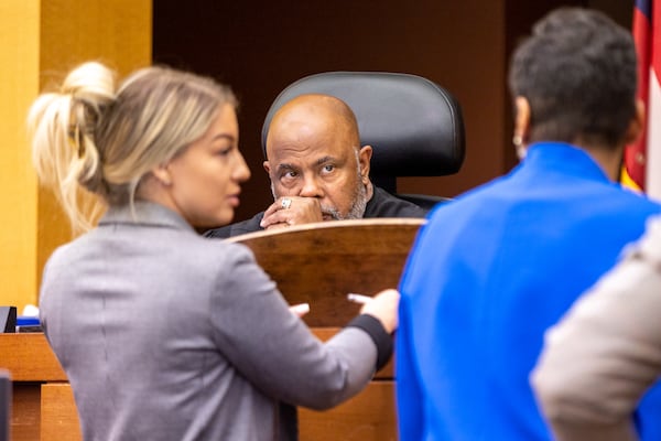 (L-R) Attorney Nicole Moorman, Judge Ural Glanville, and Deputy District Attorney Adriane Love confer during the probation revocation hearing of Quantavious Grier, brother of rapper Young Thug, at Fulton County court in Atlanta on Monday, June 5, 2023. (Arvin Temkar / arvin.temkar@ajc.com)