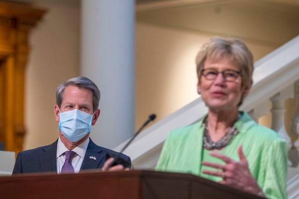 03/16/2021 —Atlanta, Georgia — Gov. Brian Kemp listens as Kathleen Toomey, Commissioner for the Georgia Department of Public Health, makes remarks about the state’s COVID-19 vaccination roll-out during a presser at the Georgia State Capitol downtown Atlanta, Tuesday, March 16, 2021.(Alyssa Pointer / Alyssa.Pointer@ajc.com)