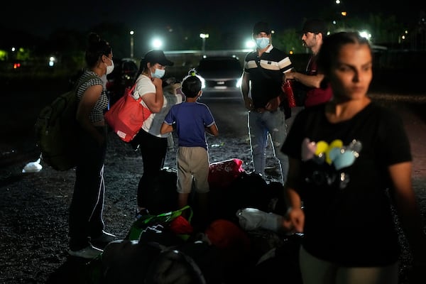 Iranian migrants who were held in a Panamanian immigration temporary shelter after being deported from the U.S. arrive in Panama City, Saturday, March 8, 2025, after authorities gave them 30 days to leave the country. (AP Photo/Matias Delacroix)