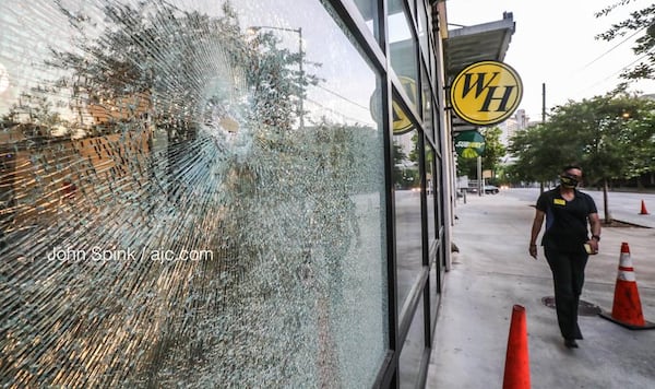 Bullets hit the front of the Waffle House on Courtland Street and injured an innocent bystander, according to a spokeswoman for the restaurant.