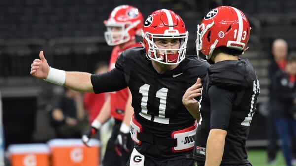 Georgia quarterback Jake Fromm (11) confers with quarterback Stetson Bennett (13) during practice in the Superdome in New Orleans, La., on Sunday, Dec. 29, 2019. The Bulldogs will face Baylor in the Sugar Bowl on Jan. 1, 2020. (Photo by Steven Colquitt/UGA Athletics)