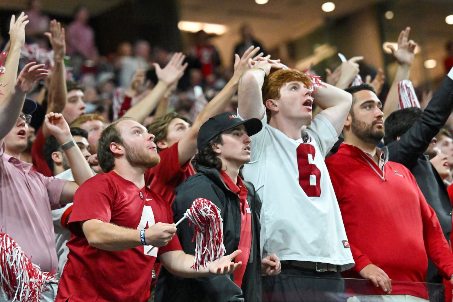 Alabama Crimson Tide fans reacts as the Georgia Bulldogs score during the second half of the SEC Championship football game at the Mercedes-Benz Stadium in Atlanta, on Saturday, December 2, 2023. (Hyosub Shin / Hyosub.Shin@ajc.com)