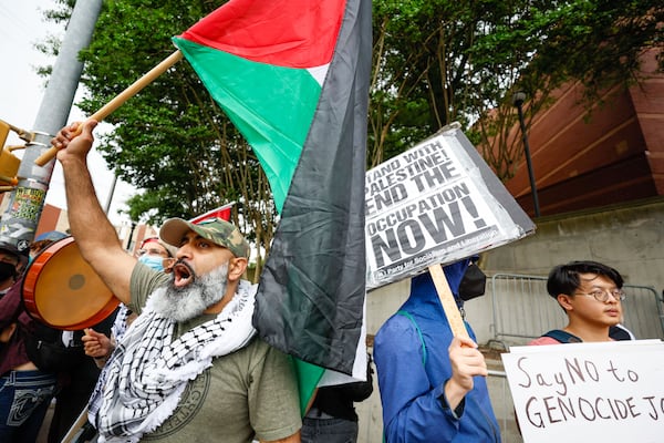 Dozens of people chant as they stand on Joseph E. Lowery Boulevard outside Morehouse College as they protest against President Joe Biden’s visit, who is the main speaker for Morehouse College’s 140th Commencement ceremony on Sunday, May 19, 2024.
(Miguel Martinez / AJC)