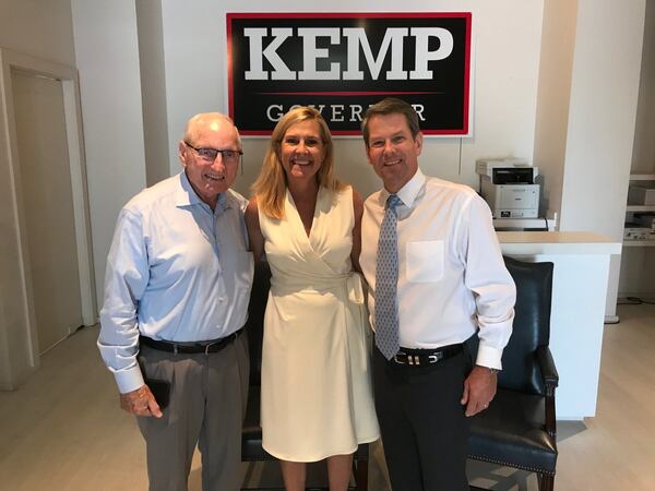 Vince Dooley stands beside Gov. Brian Kemp and his wife Marty. File photo.