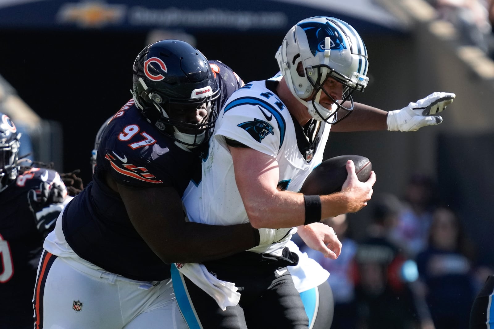 Chicago Bears defensive tackle Andrew Billings (97) sacks Carolina Panthers quarterback Andy Dalton (14) during the second half of an NFL football game Sunday, Oct. 6, 2024, in Chicago. (AP Photo/Nam Y. Huh)