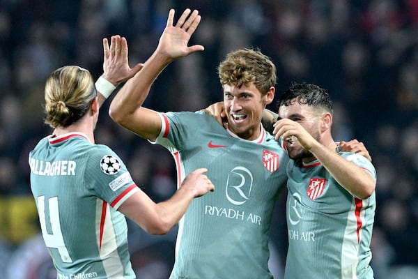 Atletico's goalscorer Marcos Llorente (center) celebrates his team's second goal with his teammates during the UEFA Champions League opening match between Sparta Prague and Athletico Madrid in Prague, Czech Republic, Tuesday, November 26, 2024. (Michaela Rihova/CTK via AP)