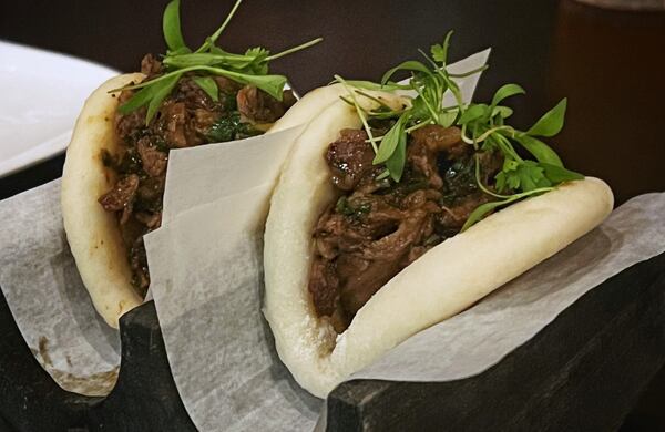 The Ashford's pork bao is a savory, filling appetizer. Henri Hollis/henri.hollis@ajc.com