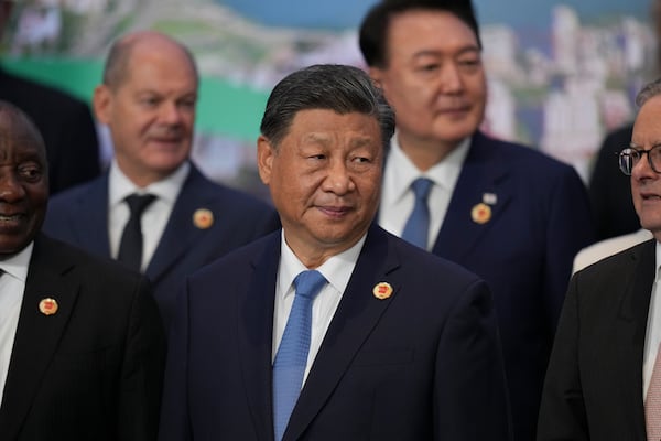 China's President Xi Jinping gathers for the world leaders' group photo at the G20 Summit, in Rio de Janeiro, Tuesday, Nov. 19, 2024. (AP Photo/Silvia Izquierdo)