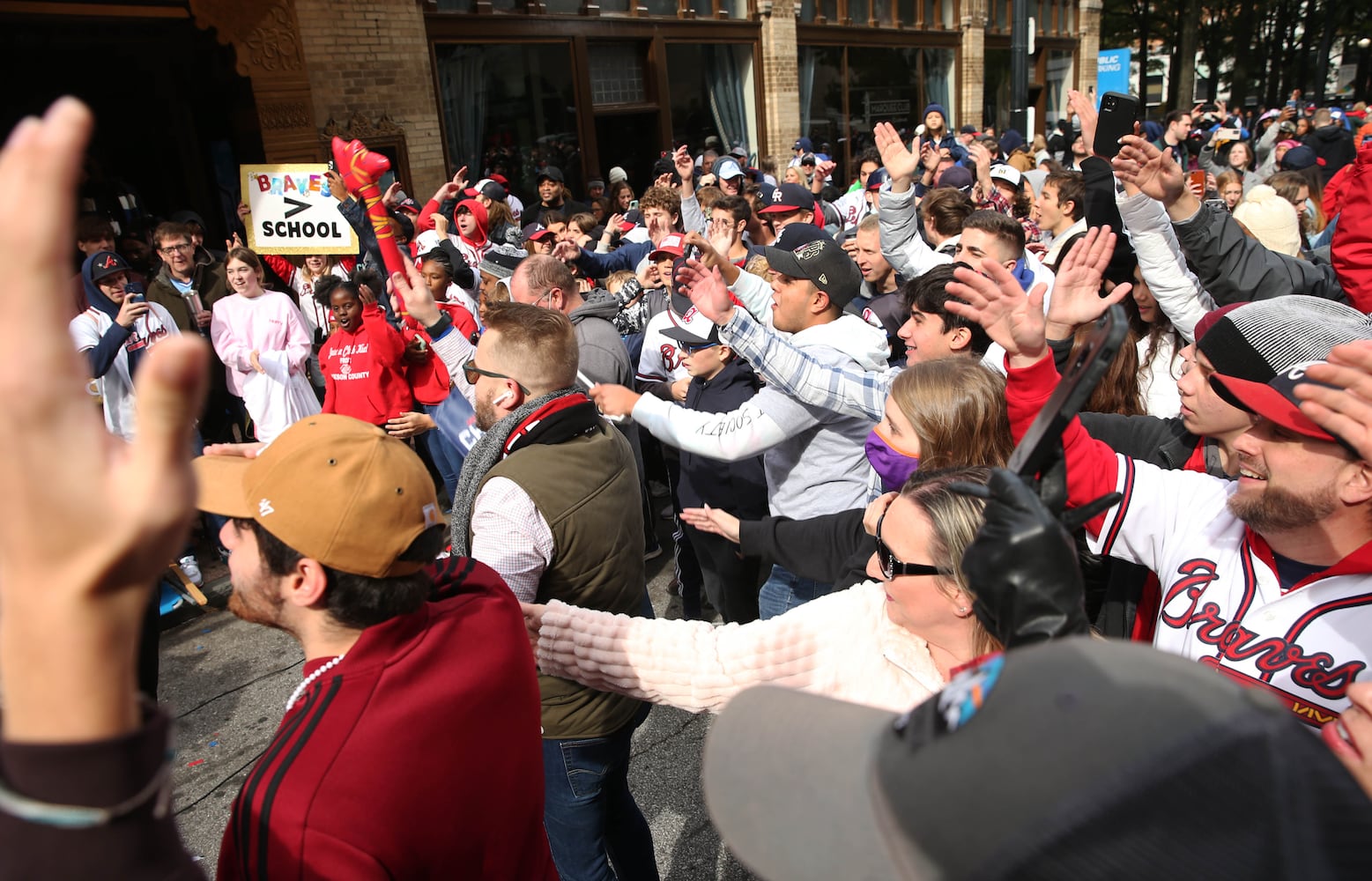 Fans do the tomahawk chop following the Braves' World Series parade in Atlanta, Georgia, on Friday, Nov. 5, 2021. (Photo/Austin Steele for the Atlanta Journal Constitution)