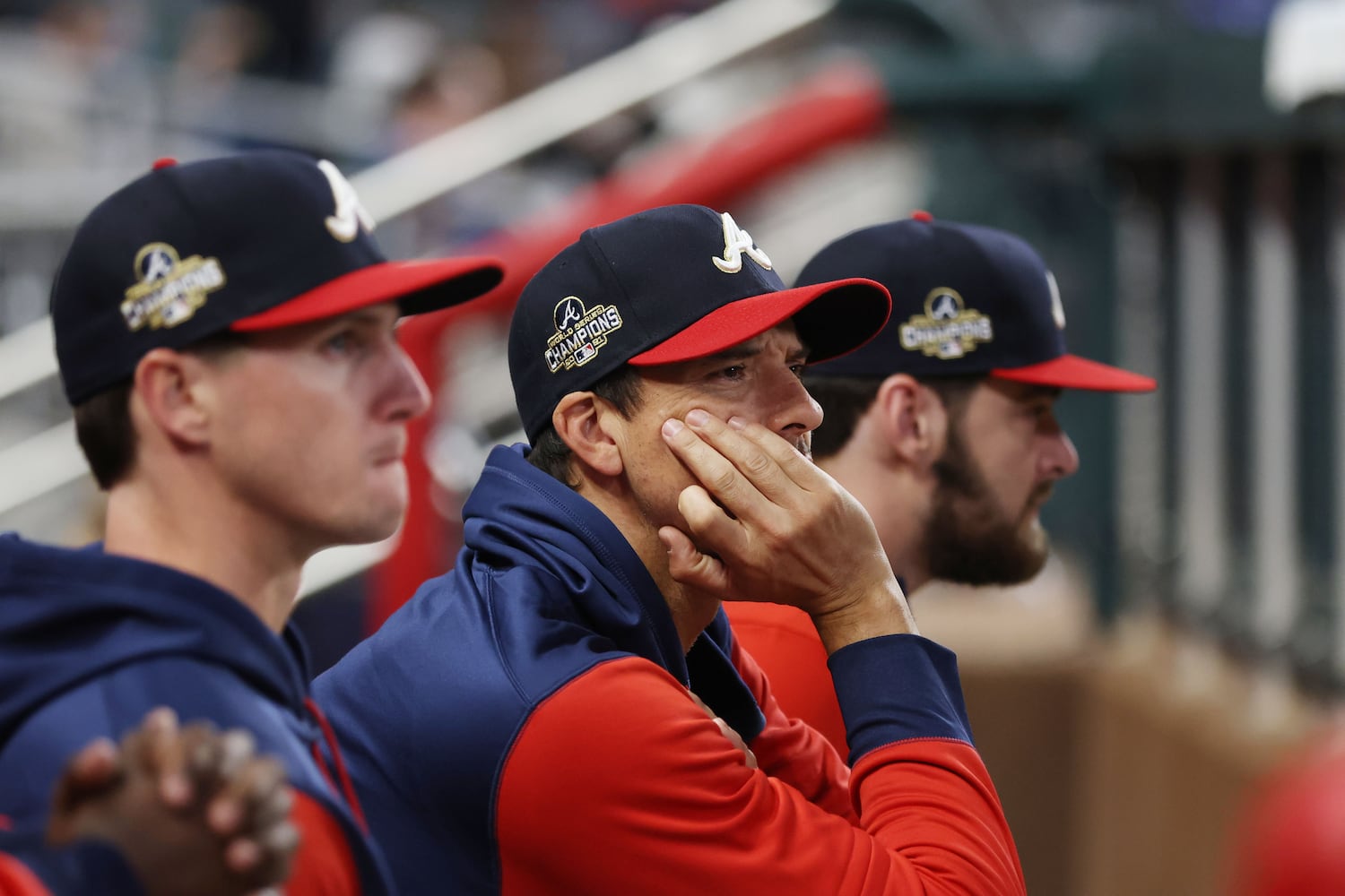 Braves bench players watch as the Nationals increase their lead Monday night at Truist Park. (Miguel Martinez/miguel.martinezjimenez@ajc.com)