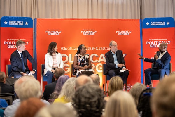 (Left to Right) Greg Bluestein, Patricia Murphy, Tia Mitchell, and Bill Nigut listens to Senator Warnock speaking at the Politically Georgia on the Road Tour on Monday, July 22, 2024 in Savannah, GA. (AJC Photo/Katelyn Myrick)