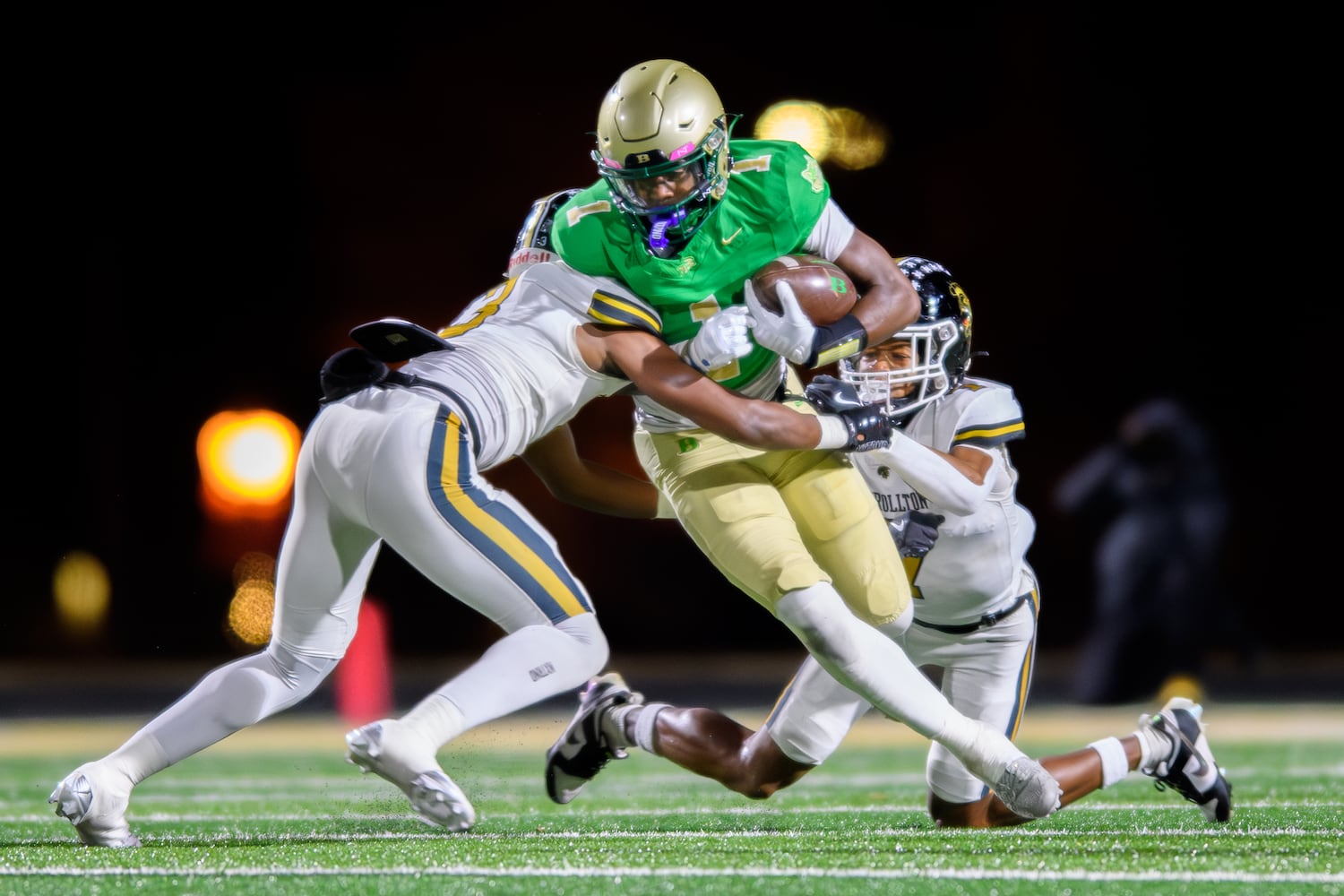 Buford's Ethan Ervin gains yards against Carrollton. (Jamie Spaar for the Atlanta Journal Constitution)