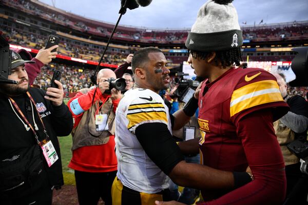 Pittsburgh Steelers quarterback Russell Wilson (3) greets Washington Commanders quarterback Jayden Daniels (5) after an NFL football game, Sunday, Nov. 10, 2024, in Landover, Md. (AP Photo/Nick Wass)