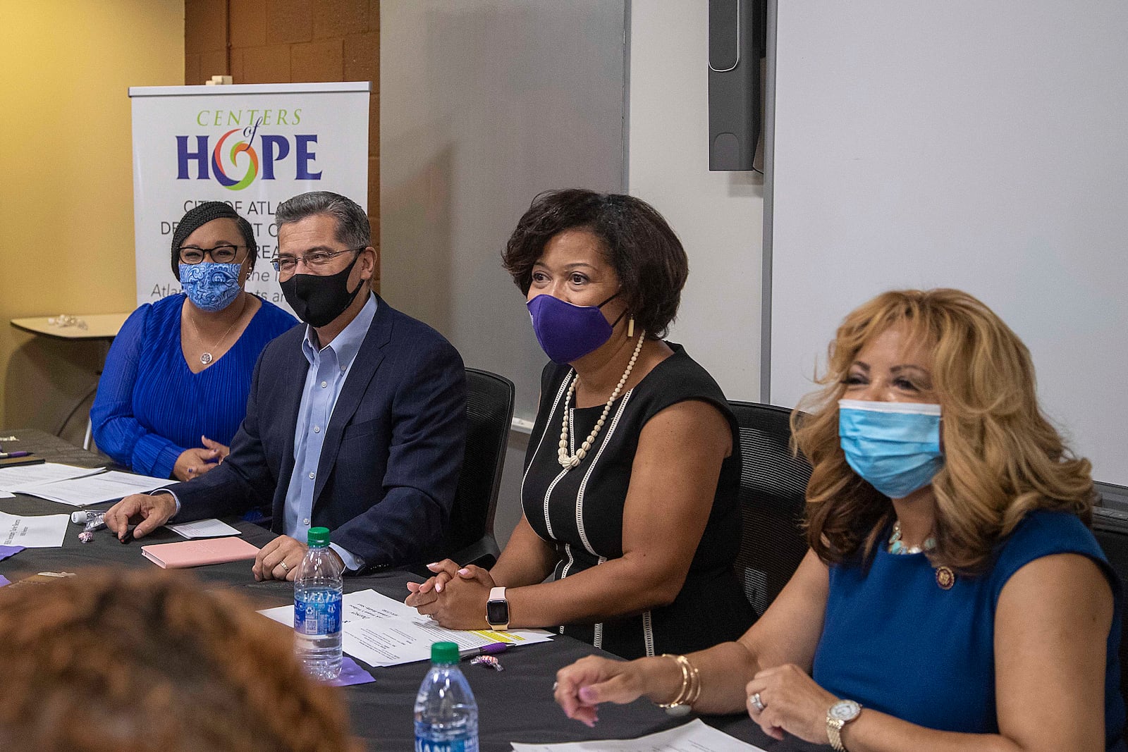 08/02/2021 —Atlanta, Georgia — U.S. Congresswoman Nikema Wiliams, from left, U.S. Department of Health and Human Services Secretary Xavier Becerra, Center for Black Women’s Wellness President and CEO Jemea Dorsey and U.S. Congresswoman Lucy McBath, right, participate in a roundtable discussion with women at The Center for Black Women’s Wellness in Atlanta’s Mechanicsville community, Monday, August 2, 2021. (Alyssa Pointer/Atlanta Journal Constitution)