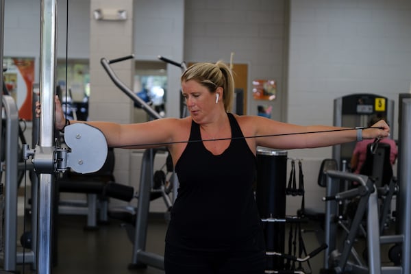 Emily Stevens works out at the YMCA in Gainesville on her day off.  Stevens left her previous job as a staff ER nurse in Gainesville, where she worked some of the hardest shifts in the pandemic.  She joined an agency as a "traveler," or contract nurse, and is now an ER nurse in Duluth.  She is run less ragged by her shifts, and feels that when she has time off she is more able to work on restoring her health.  (PHOTO by Arvin Temkar / arvin.temkar@ajc.com)