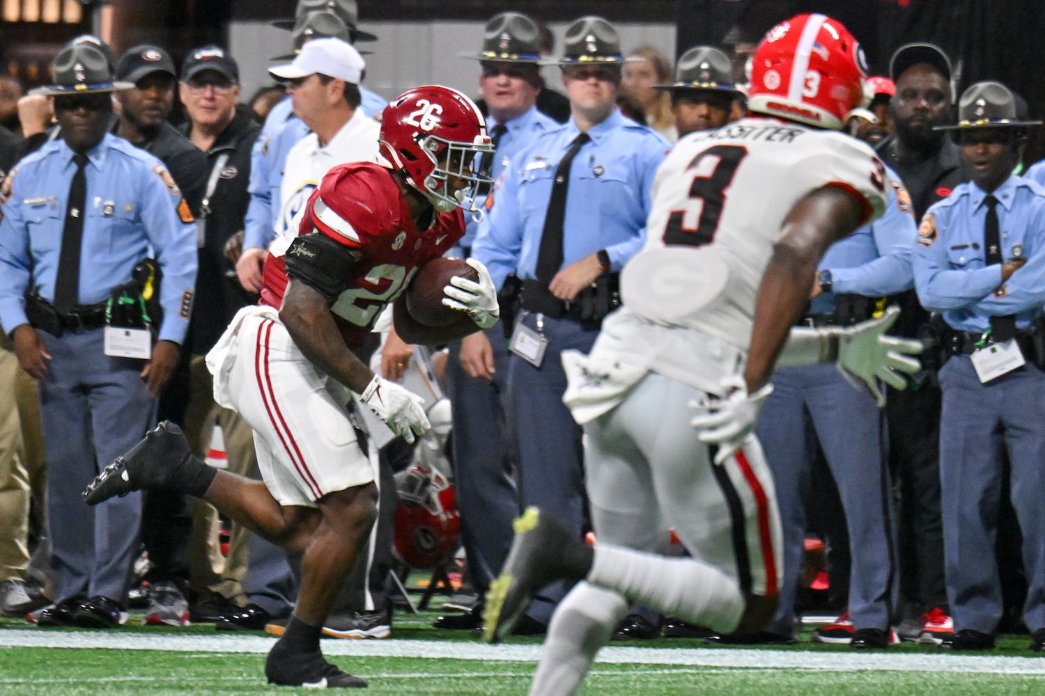 Alabama Crimson Tide running back Jam Miller (26) scores a touchdown on a 28 yard pass against the Georgia Bulldogs during the first half of the SEC Championship football game at the Mercedes-Benz Stadium in Atlanta, on Saturday, December 2, 2023. (Hyosub Shin / Hyosub.Shin@ajc.com)