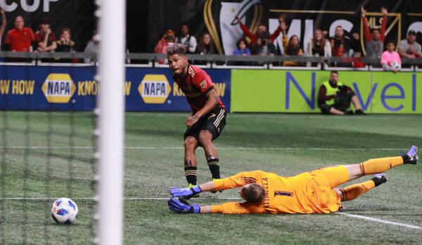 12/8/18 - Atlanta - Atlanta United forward Josef Martinez (7) scores United's first goal, defended by Portland Timbers goalkeeper Jeff Attinella (1). The Atlanta United soccer team plays the Portland Timbers for the MLS Cup, the championship game of the Major League Soccer League at Mercedes-Benz Stadium in Atlanta.   CURTIS COMPTON / CCOMPTON@AJC.COM