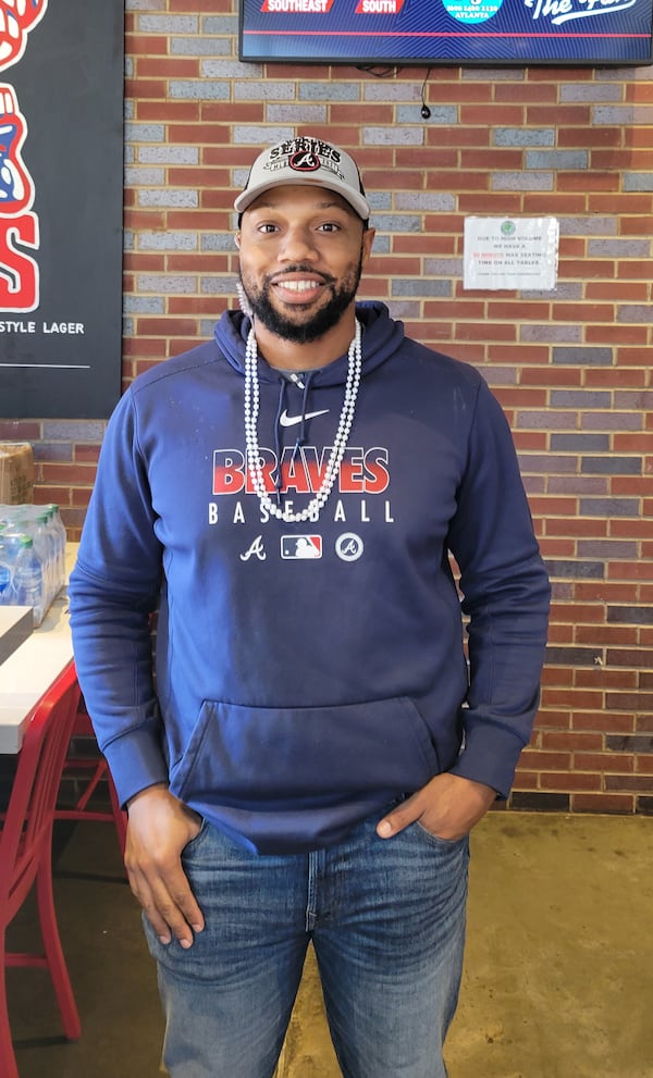 Derek Mason, a 29-year-old bartender at the Battery, prepares to cater to rowdy fans once the World Series Game 6 begins Tuesday, Nov. 2, 2021. (Sam Sinclair / Fresh Take Georgia)