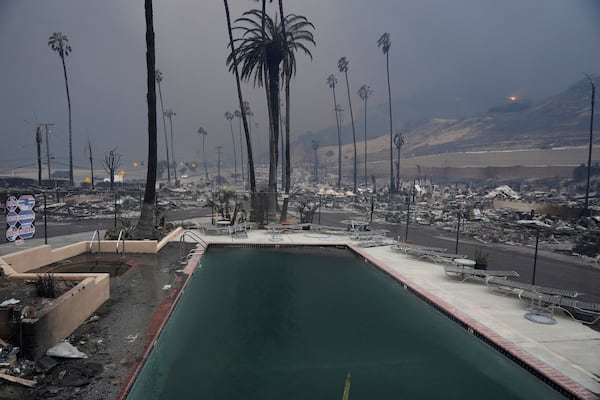 A wildfire-ravaged property is shown after the Palisades Fire swept through in the Pacific Palisades neighborhood of Los Angeles, Wednesday, Jan. 8, 2025. (AP Photo/Damian Dovarganes)