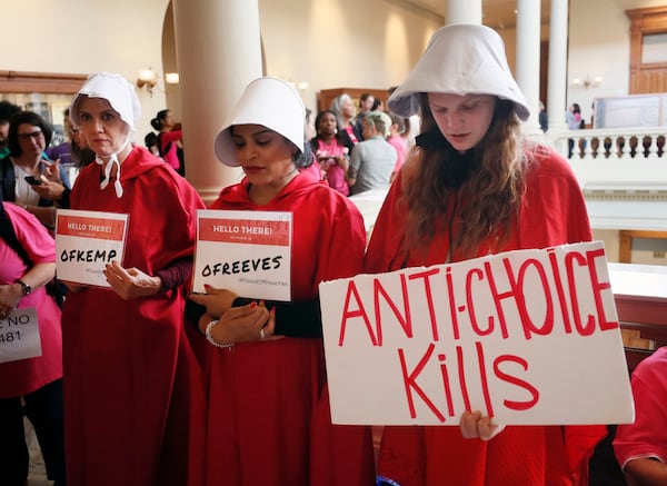 March 14, 2019 - Atlanta - Georgia members of the Handmaid Coalition were protesting HB 481 outside the Capitol today.   A Senate hearing was held Thursday for the "fetal heartbeat bill."  Advocates on both sides are expected to fill the Capitol as the committee debates the bill that would outlaw most abortions after six weeks.    Bob Andres / bandres@ajc.com