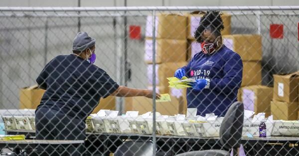 Fulton County election workers resumed counting ballots at 9:30 a.m. on Wednesday, Jan. 6, 2021. (John Spink / John.Spink@ajc.com)

