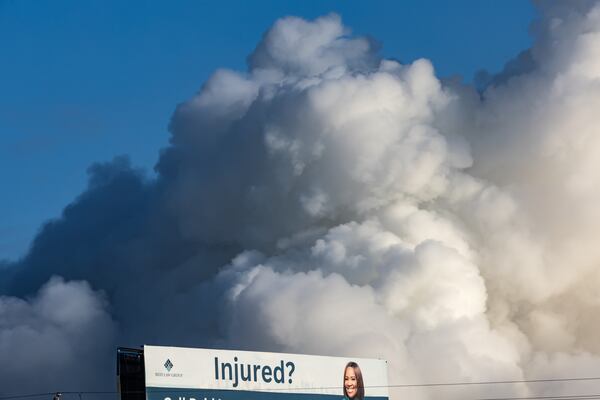 A large plume sits in the sky above Conyers on Monday Sept. 30, 2024 following the evacuation of about 17,000 people. Several metro Atlanta counties reported a haze and chemical smell Monday morning. A shelter-in-place order for all of Rockdale County has been extended indefinitely Monday. (John Spink/AJC)