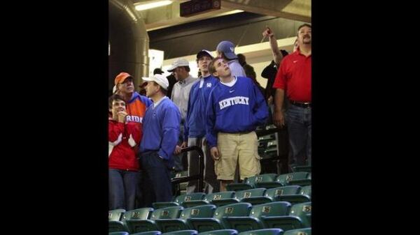 Fans observe damage to the Georgia Dome after a tornado struck downtown Atlanta during the SEC Tournament in 2008.(AJC file photo)