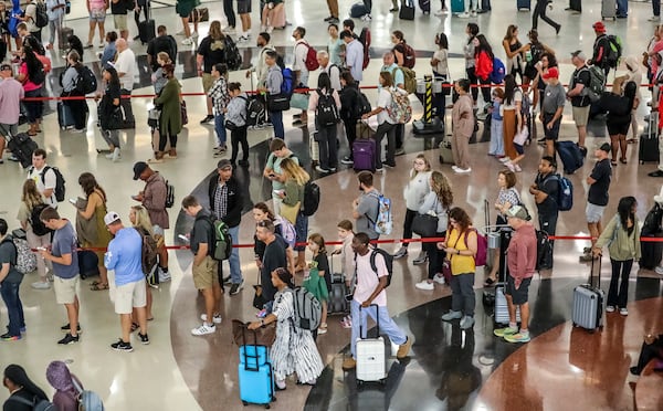 September 1, 2023 Atlanta: Hartsfield-Jackson International Airport’s domestic atrium was full of long lines of travelers waiting to go through security on Friday, Sept. 1, 2023. (John Spink / John.Spink@ajc.com)

