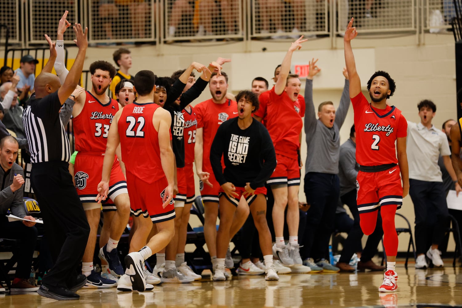 Liberty Flames players react with forward Kyle Rode (22) after scoring a three-pointer against the Kennesaw State Owls at the Kennesaw State Convention Center on Thursday, Feb 16, 2023. Miguel Martinez / miguel.martinezjimenez@ajc.com