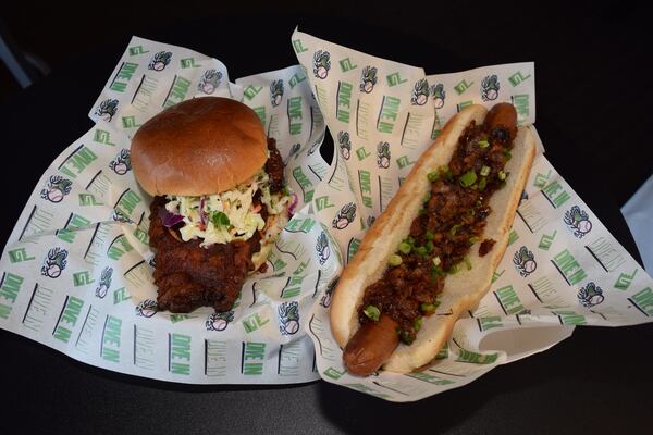 Nashville hot chicken sandwich and footlong onion jam bacon hot dog are new offerings at Coolray Field. / Courtesy of Ismael Caro / Gwinnett Stripers.