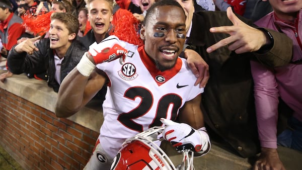 Georgia Bulldogs defensive back J.R. Reed (20) celebrates with fans after Georgia’s win over Auburn at Jordan-Hare Stadium in Auburn, Ala. 