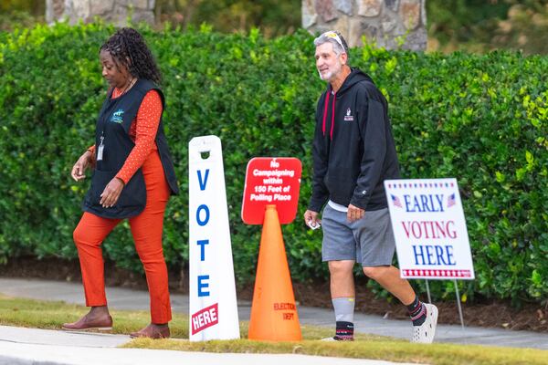 Voters are seen exiting the polling station, Thursday, Oct. 31, 2024, in Stockbridge, Ga. (AP Photo/Jason Allen)