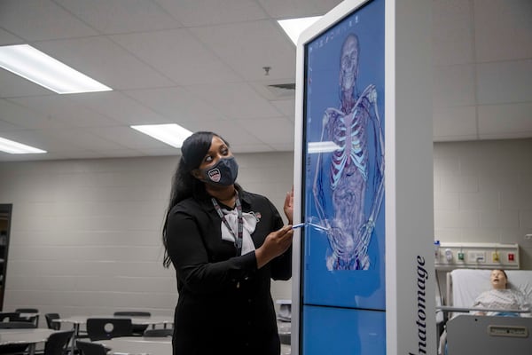 11/11/2020 —  Marietta, Georgia — Cobb Innovation and Technology Academy Director Dr. Tiffany Barney uses a three dimensional anatomy screen in a medical learning classroom in Marietta, Wednesday, November 11, 2020.  (Alyssa Pointer / Alyssa.Pointer@ajc.com)