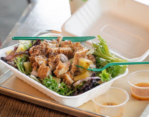 This Boxcar Betty’s salad includes fried chicken, bibb lettuce, shallots, pickled green tomatoes, candied pecans and a lime vinaigrette. Courtesy of Boxcar Betty’s