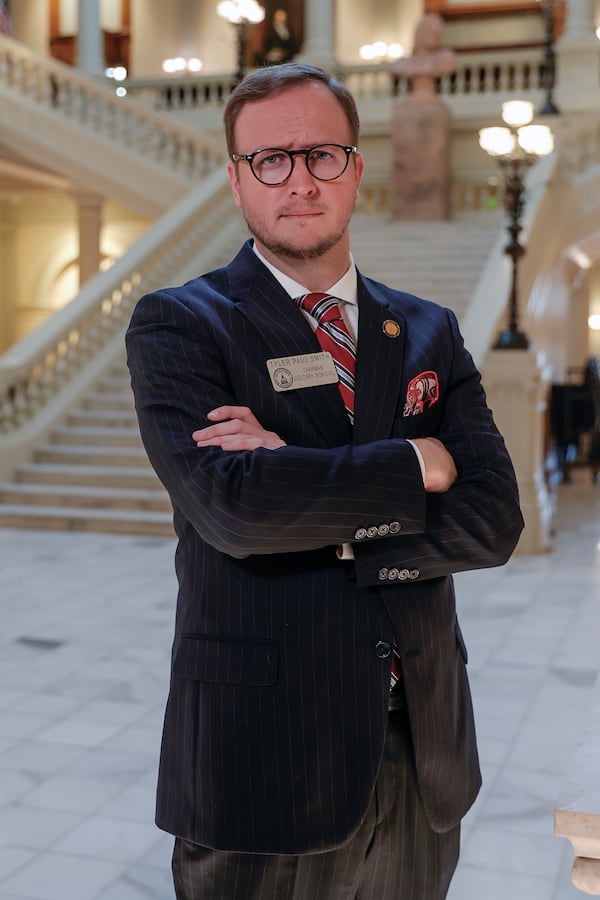 Rep. Tyler Paul Smith, R-Breman, says a pocket square is "always, always, always" necessary. "Without a pocket square, I feel completely naked. ... I always recommend that anybody that has a full suit on, you need that pocket square," he said. "It makes it elegant.” (Natrice Miller/ natrice.miller@ajc.com)