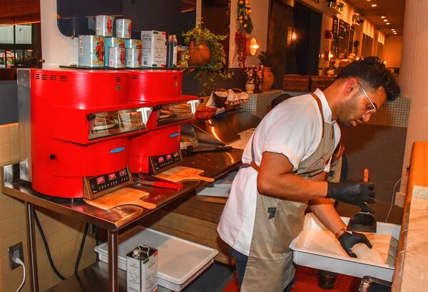 Two modern pizza ovens that require no complicated outside venting systems cook the pizzas at Belli Pizzeria at the new Politan Row at Colony Square in Atlanta. (Chris Hunt for The Atlanta Journal-Constitution)