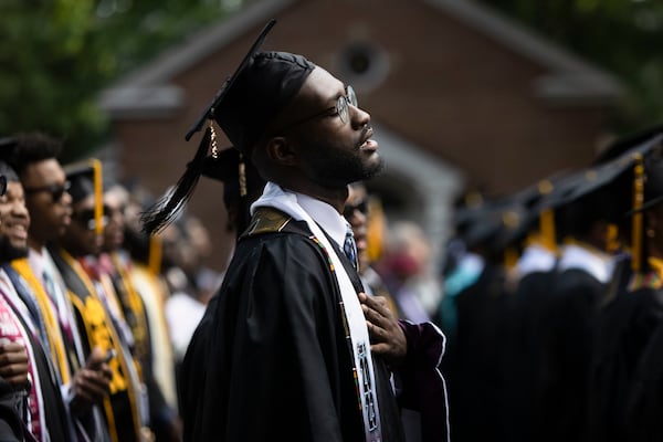 A member of the Morehouse College class of 2023 sings "Lift Every Voice and Sing" during the Morehouse College commencement ceremony on Sunday, May 21, 2023, on Century Campus in Atlanta. The graduation marked Morehouse College's 139th commencement program. CHRISTINA MATACOTTA FOR THE ATLANTA JOURNAL-CONSTITUTION