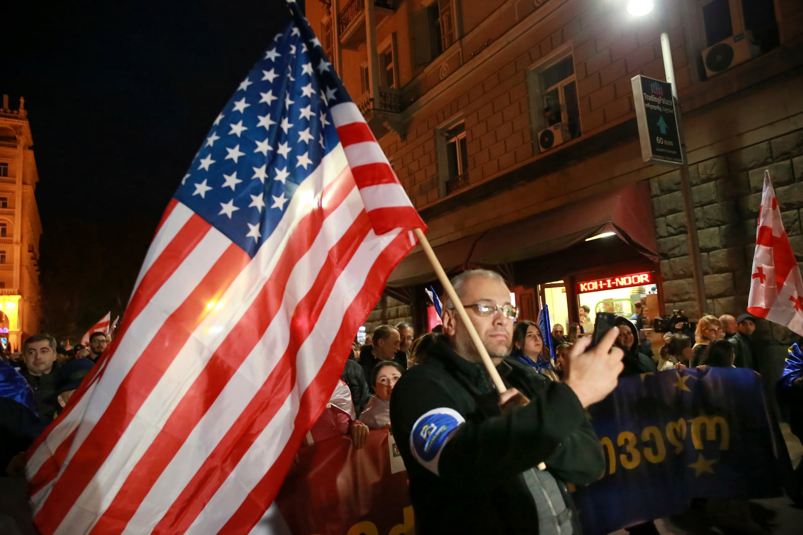 A protester takes part in a rally against alleged violations in a recent parliamentary election in Tbilisi, Georgia, Monday, Nov. 4, 2024. (AP Photo/Zurab Tsertsvadze)