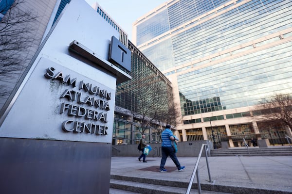 A couple of people are seen headed to the Sam Nunn Atlanta Federal Center on Monday, February 24, 2025. This day marked the first full return-to-office day for numerous federal workers in downtown Atlanta.
(Miguel Martinez/ AJC)