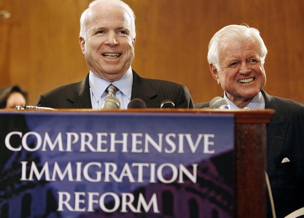 WASHINGTON -  Sen. John McCain (R-AZ) (L) and Sen. Edward Kennedy (D-MA) laugh during an immigration reform rally and news conference on Capitol Hill June 27, 2006 in Washington, DC. McCain died on Aug. 25, 2018, nine years to the day after Kennedy and from the same disease, glioblastoma.  (Photo by Chip Somodevilla/Getty Images)