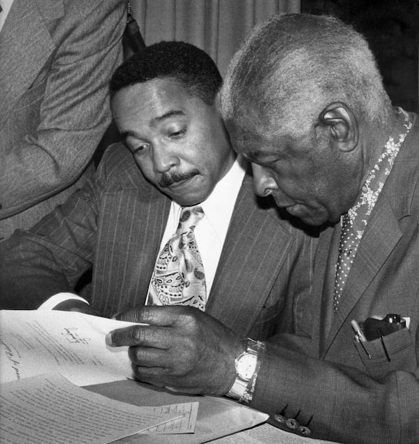 Alonzo Crim (left), former superintendent of Atlanta Public Schools, confers with Benjamin Mays, the former president of Morehouse College, in this photo taken in the early 1970s. (AJC STAFF/FILE PHOTO)