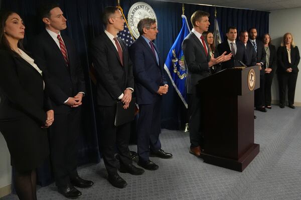 Christopher R. Kavanaugh, the United States Attorney for the Western District of Virginia, gestures while announcing that the McKinsey & Company agreed to pay $650 million for helping Purdue Pharma boost opioid sales during a news conference at the Moakley Federal Courthouse, Friday, Dec. 13, 2024, in Boston. (AP Photo/Charles Krupa)