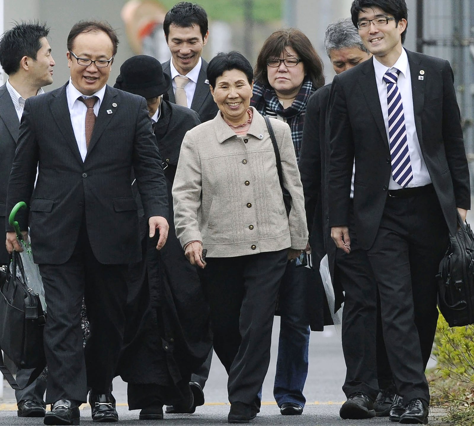 Hideko Hakamada, center, sister of former boxer Iwao Hakamada who has been on death row for a 1966 quadruple murder case, visits Tokyo Detention Center in Tokyo after a court ordered a retrial for her brother, on March 27, 2014. Japanese prosecutors said on Oct. 8, 2024 they will not appeal the Sept. 26 ruling of the Shizuoka District Court that acquitted the world’s longest-serving death-row inmate in a retrial. (Kyodo News via AP)