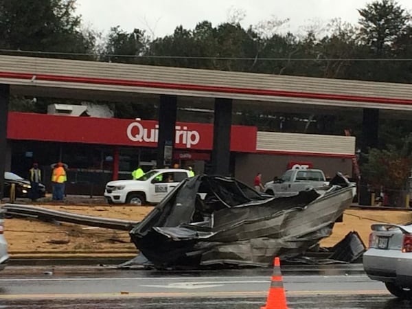 A QuikTrip is closed off Mableton Parkway after a piece of roofing fell into the roadway.