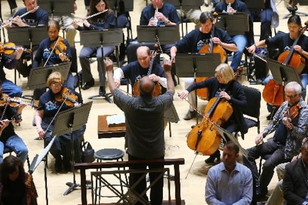 Concertmaster David Coucheron, featured soloist in the Mozart Violin Concerto No 5, and music director Robert Spano during rehearsals for the delayed opening of the Atlanta Symphony Orchestra’s 70th anniversary season on Tuesday. CURTIS COMPTON / CCOMPTON@AJC.COM