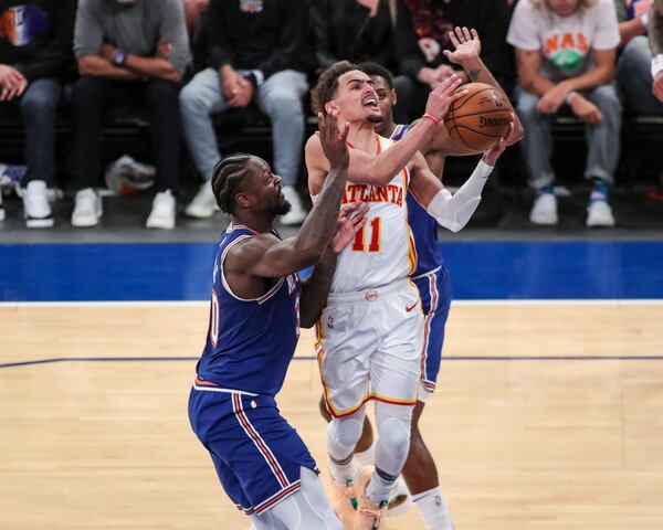 Atlanta Hawks guard Trae Young (11) drives past New York Knicks forward Julius Randle (30) in the fourth quarter of Game 5 of an NBA basketball first-round playoff series Wednesday, June 2, 2021, in New York. (Wendell Cruz/Pool Photo via AP)