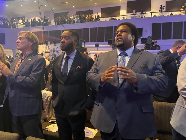 Minister Michael Lindell of Atlanta (center) and Pastor Enos Chamberlain of Columbia, Mo., (right) gathered with supporters of former President Donald Trump at the inaugural National Faith Summit in Powder Springs on Oct. 28.