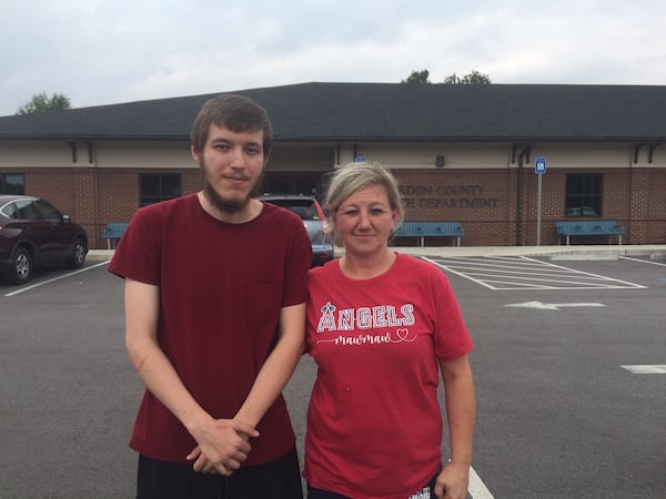 Amie Chitwood, of Calhoun, met her 23-year-old son, Gene Patterson, at the Gordon County Health Department on Tuesday, Aug. 3, 2021, and watched him get his first shot of the Moderna vaccine. “I worry about my grandchildren going to school right now," Chitwood said. "They’re too young (to get the shots).” Patterson added, “I just don’t like going out of my way for things.” (Johnny Edwards / Johnny.Edwards@ajc.com)