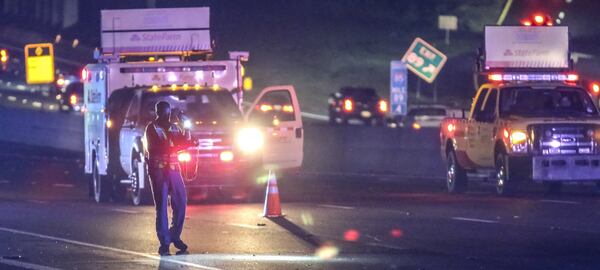 A deadly accident blocked all northbound lanes of I-85 near North Druid Hills Road for hours on Sept. 22 after a man was struck and killed. JOHN SPINK/JSPINK@AJC.COM