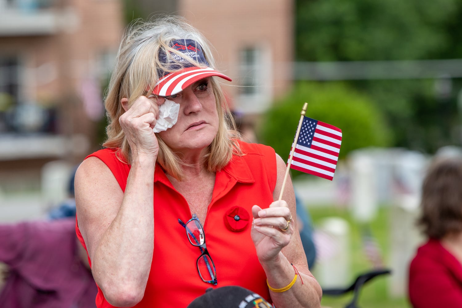 Julie Porter is emotional at the 77th annual Memorial Day Observance at the Marietta National Cemetery on Monday, May 29, 2003.  (Jenni Girtman for The Atlanta Journal-Constitution)